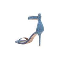 The Gisele Denim Sandal showcases a light blue denim upper with an ankle strap and open toe, presented in a side profile view against a white background.
