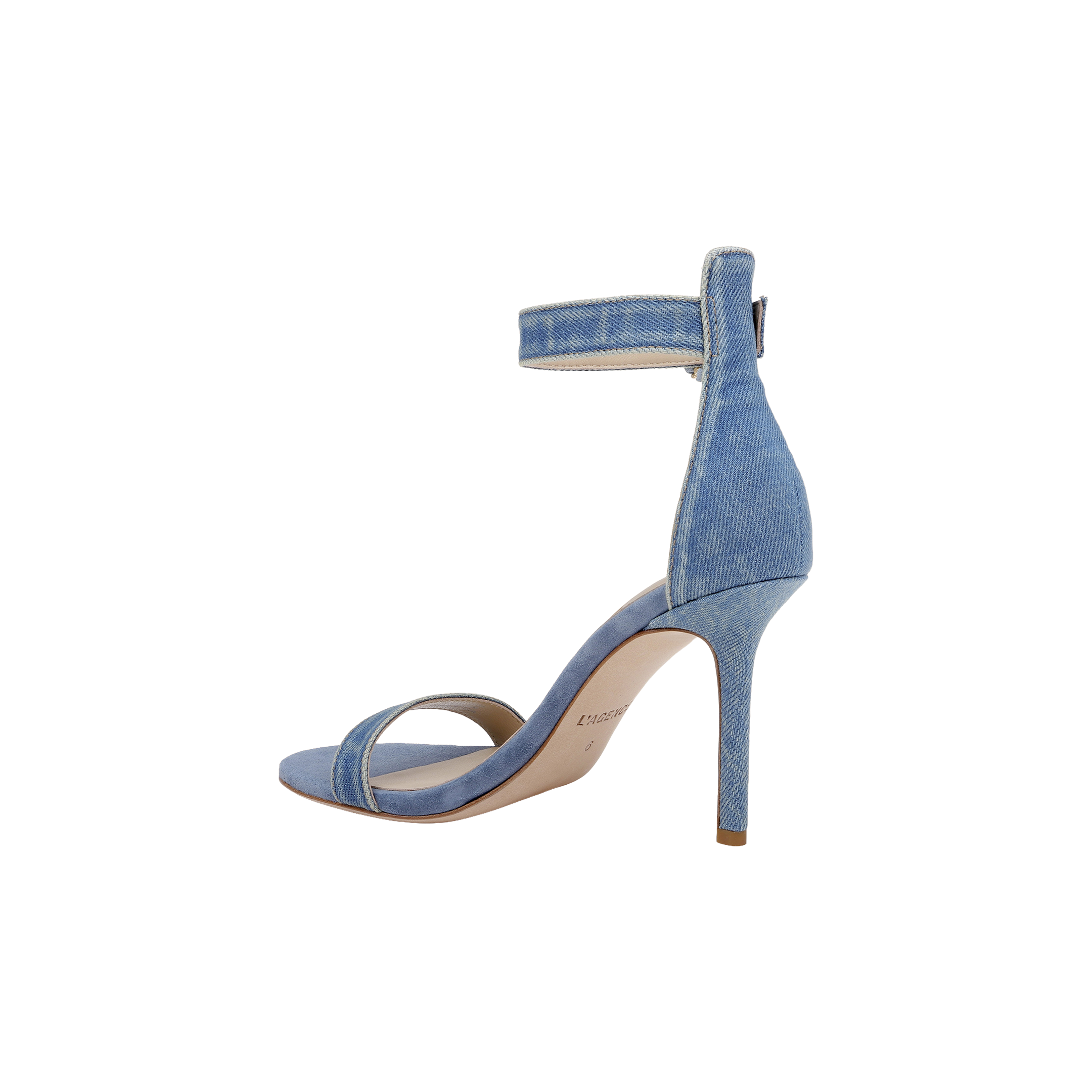 The Gisele Denim Sandal showcases a light blue denim upper with an ankle strap and open toe, presented in a side profile view against a white background.
