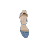 A top view of the Gisele Denim Sandal, featuring light blue suede with a single front strap and an ankle strap fastened by a small buckle. The beige insole is labeled LAGENCE, and the sandal is displayed against a white background.