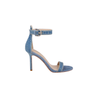 The Gisele Denim Sandal features a denim upper with an ankle strap, a buckle closure, and an open toe. Shown in side profile on a plain white background, this high-heeled sandal combines classic style with modern elegance.