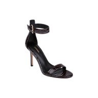 The Gisele Leather Sandal is a black, high-heeled ankle-strap sandal featuring a gold buckle, open toe, and crocodile embossed leather finish, displayed on a white background.