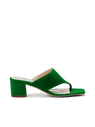 The Estelle Sandal is a green suede block heel with a wide strap, open toe, and chunky heel, showcasing a stylish thong-style front design and displayed on a white background.