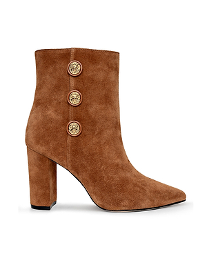 The Theodora Block-Heel Bootie by L'AGENCE is a brown buckskin suede pointed-toe bootie with a high block heel and three gold buttons on the side.