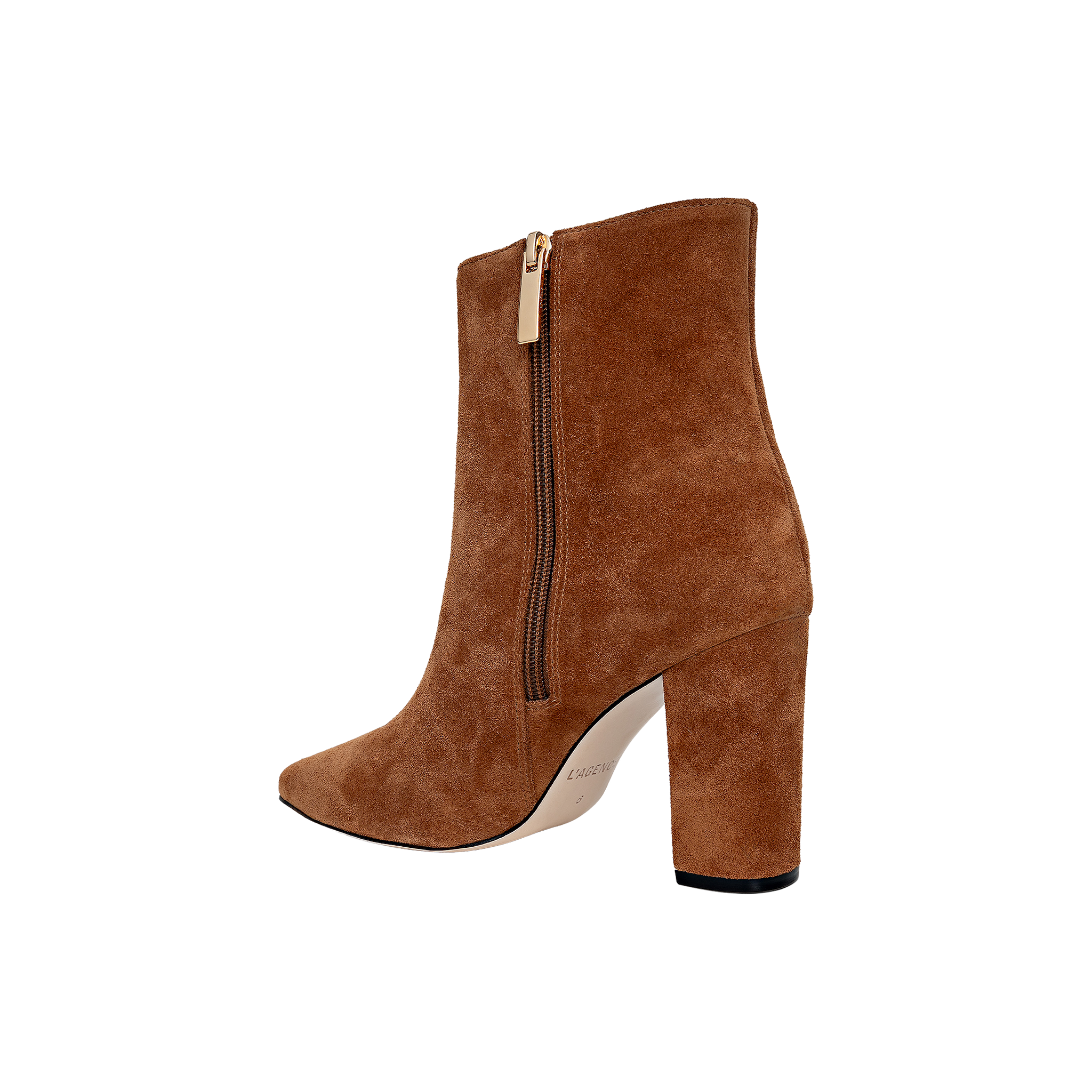 The Theodora Block-Heel Bootie is a tan buckskin suede high-heeled ankle boot featuring a pointed toe, sturdy block heel, and convenient side zipper, shown against a plain white background.