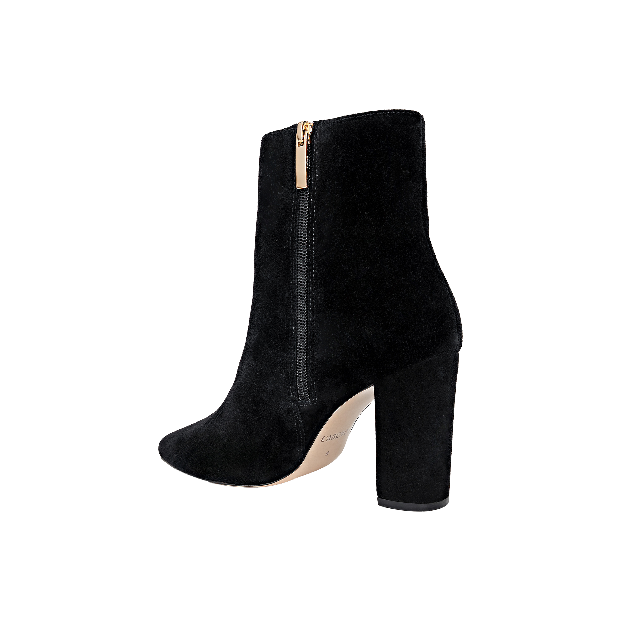 The Theodora Block-Heel Bootie is a black suede ankle boot with a chunky block heel, side zipper, and a slightly pointed toe, displayed on a white background.