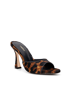 The Avery Open-Toe Mule is a sculpted stiletto mule with a bold leopard hair calf pattern, wide strap, open toe, slightly flared heel, and a black insole stamped with L’Agence in gold.