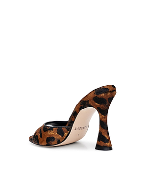 The Avery Open-Toe Mule features a sculpted stiletto with a flared heel, open toe, and striking brown and black leopard hair calf print. L’AGENCE branding is elegantly printed on the sole.