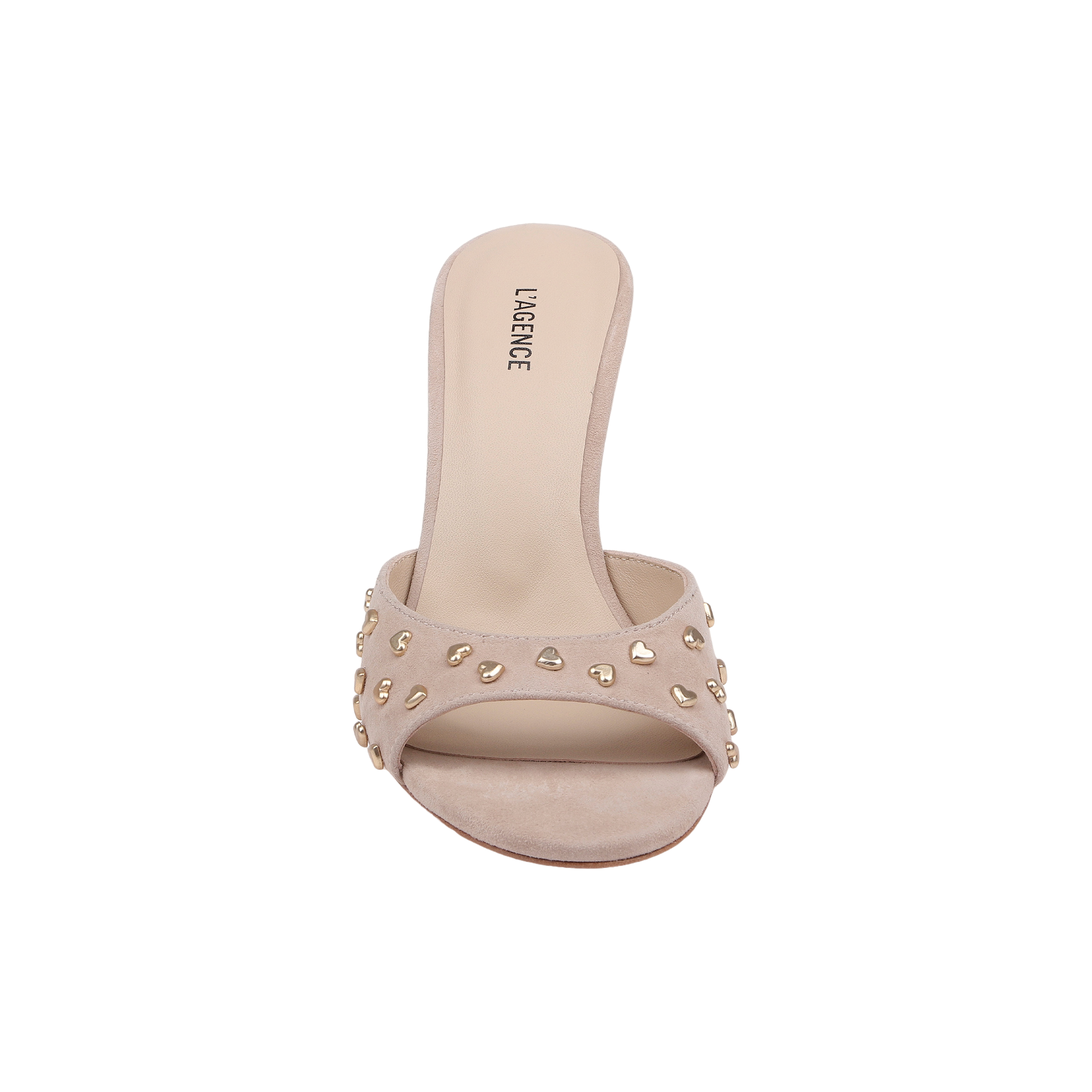 The Avery Embellished Mule is a tan suede open-toe sandal featuring gold stud accents on its wide strap and a low, flared heel, shown from the front against a plain white background.