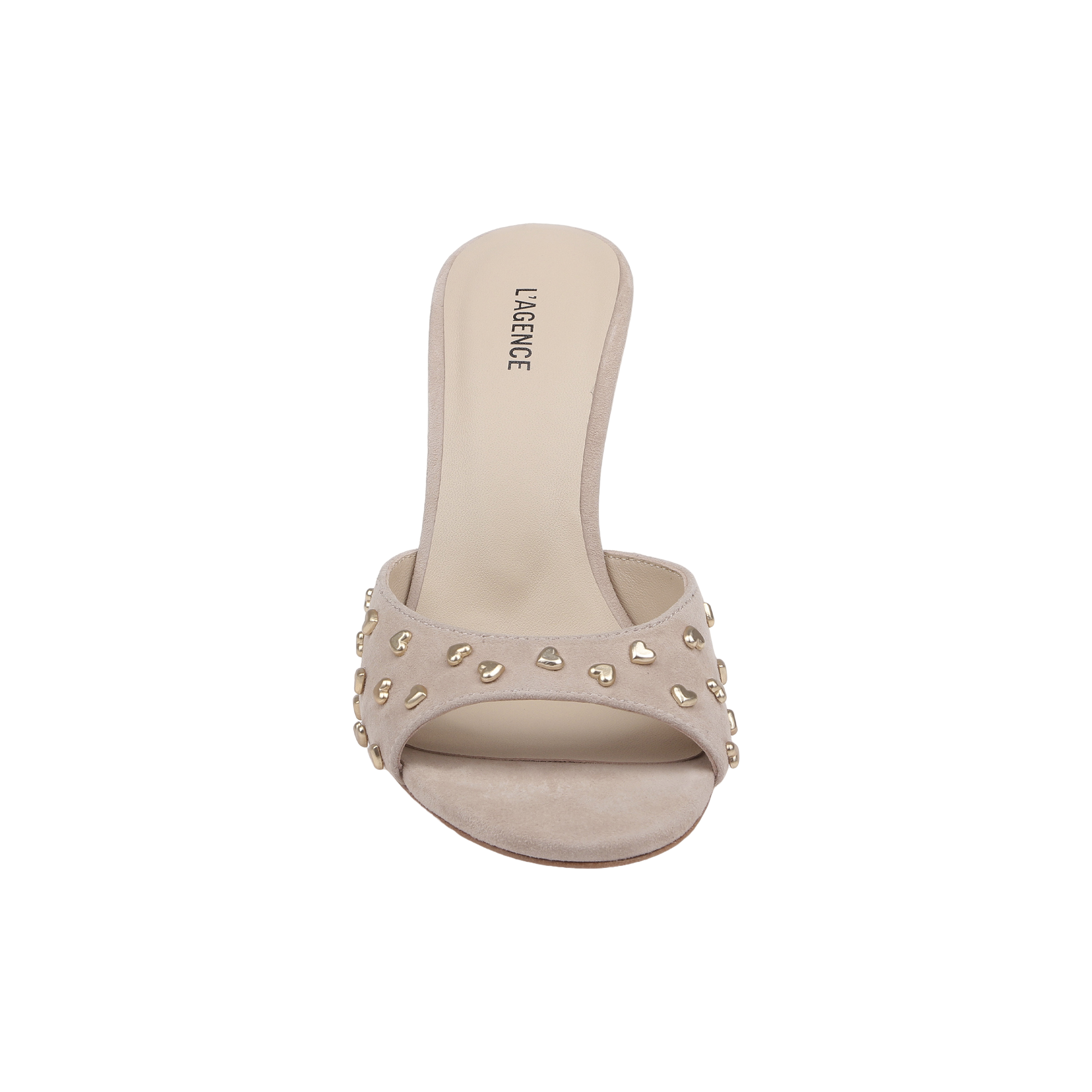 The Avery Embellished Mule is a tan suede open-toe sandal featuring gold stud accents on its wide strap and a low, flared heel, shown from the front against a plain white background.