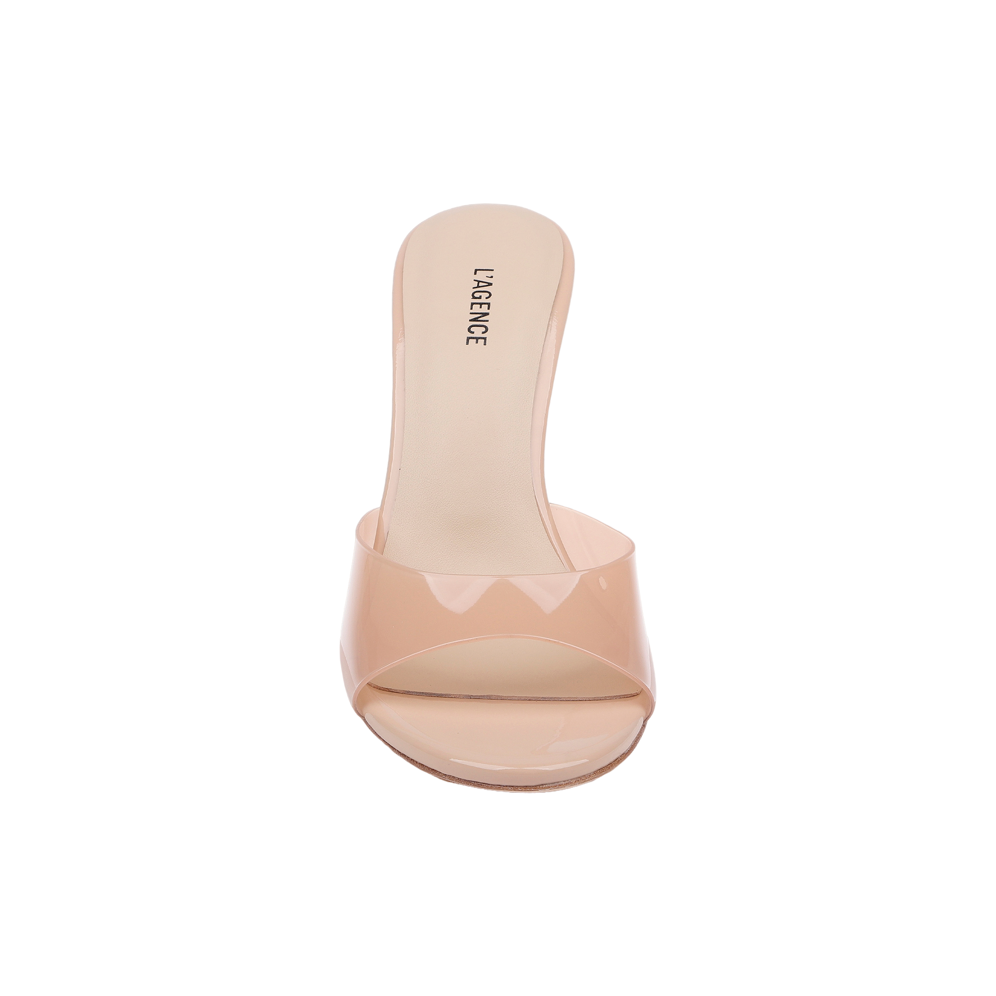 The Avery Open-Toe Mule is a light nude, sculpted stiletto mule featuring an open-toe design, a clear vamp strap, and L’AGENCE branding on the insole, shown from above against a white background.