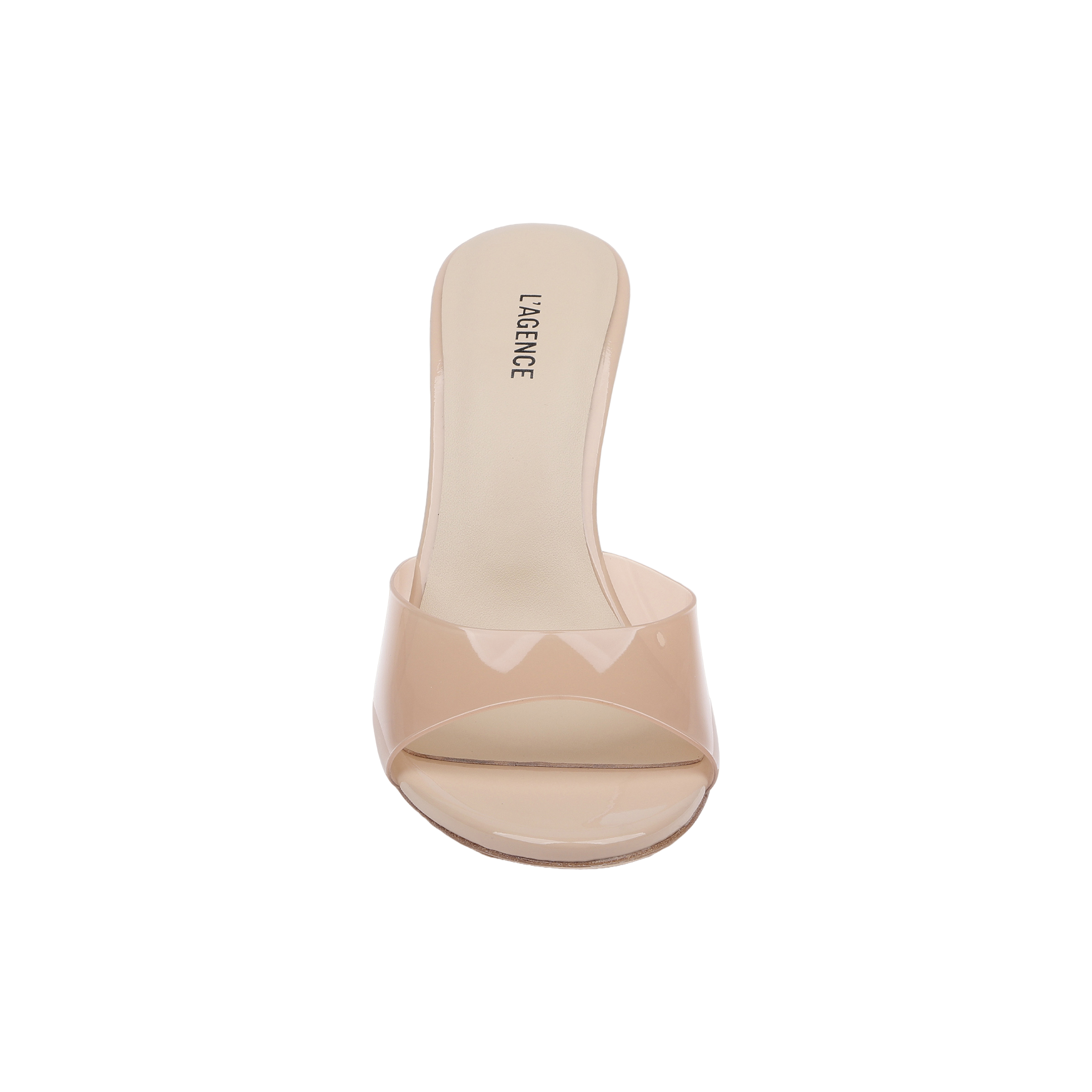 The Avery Open-Toe Mule is a light nude, sculpted stiletto mule featuring an open-toe design, a clear vamp strap, and L’AGENCE branding on the insole, shown from above against a white background.