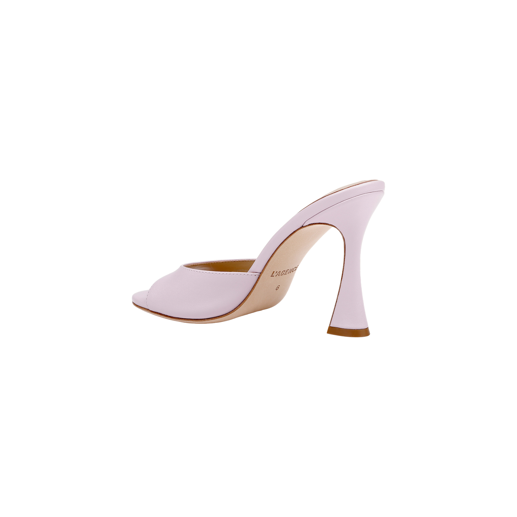 The Avery Leather Open-Toe Mule, crafted in pale pink leather, features an open toe and a sculpted, curved heel; it is displayed in profile against a white background.