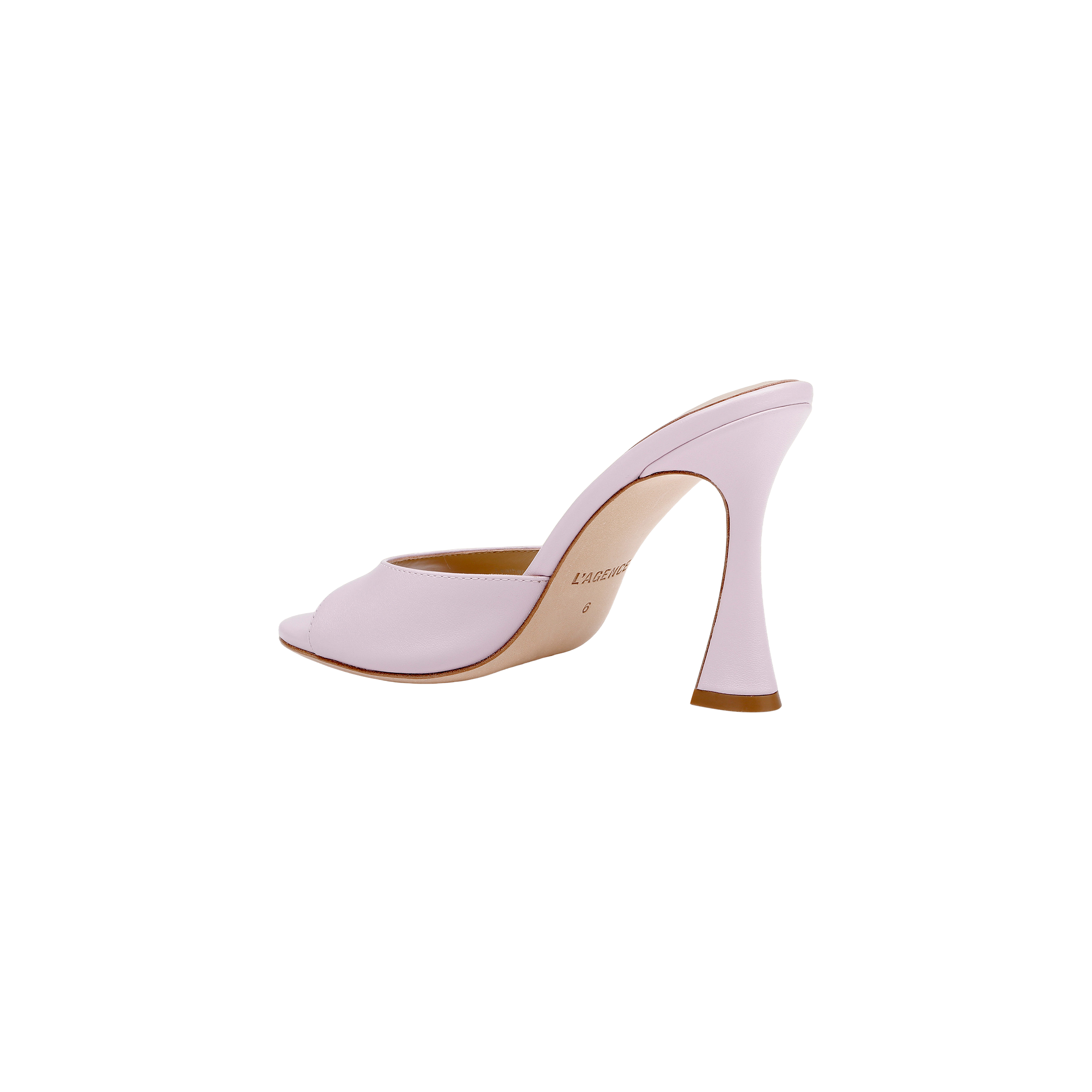 The Avery Leather Open-Toe Mule, crafted in pale pink leather, features an open toe and a sculpted, curved heel; it is displayed in profile against a white background.