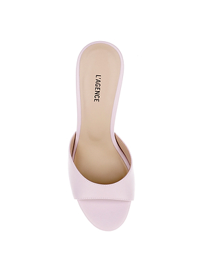 The Avery Leather Open-Toe Mule features pastel lilac leather, a wide front strap, sculpted heel, and L’AGENCE printed on the insole—shown here from a top view.