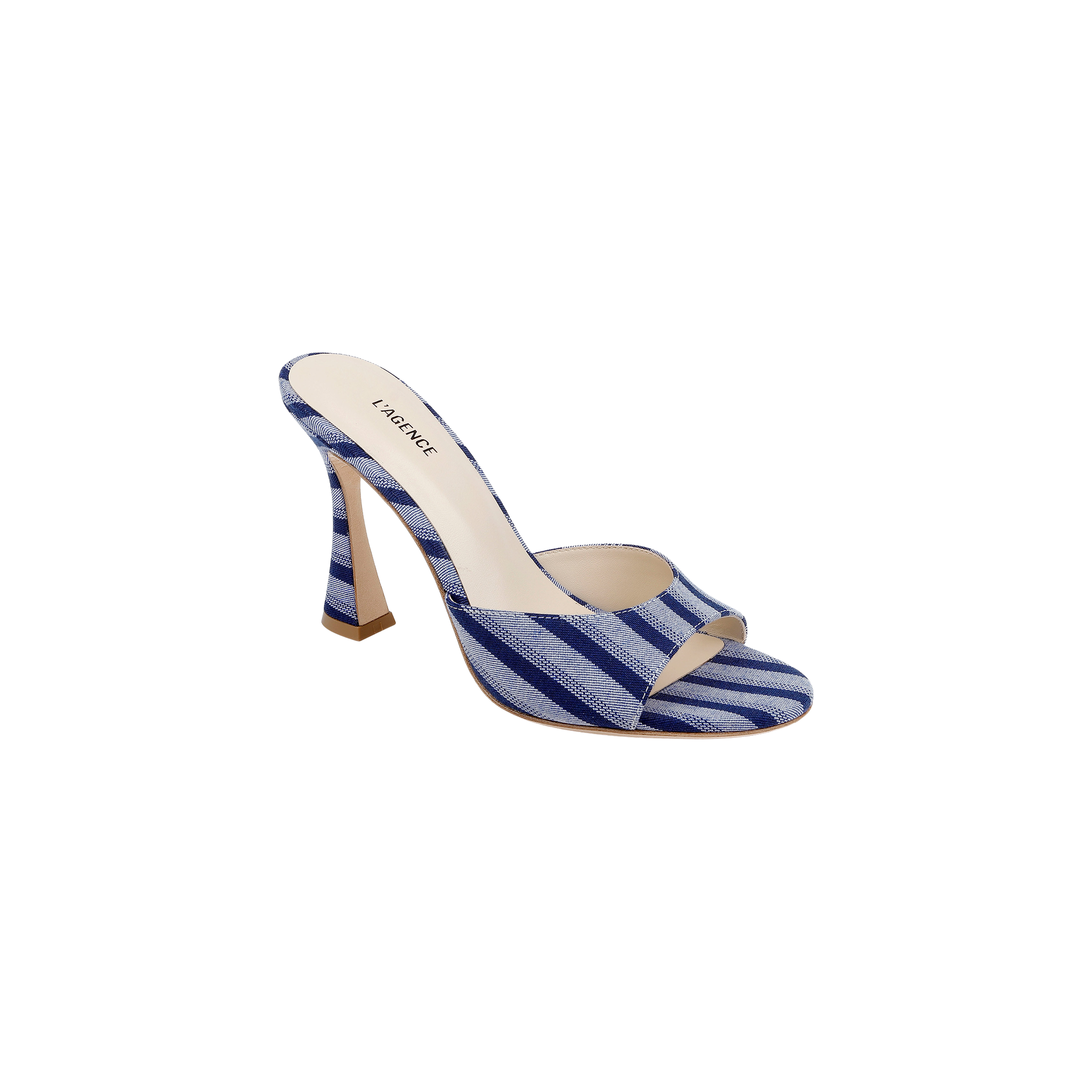 The Avery Open-Toe Mule is a blue striped denim high-heeled shoe featuring an open-toe design and a beige insole, displayed against a plain white background.