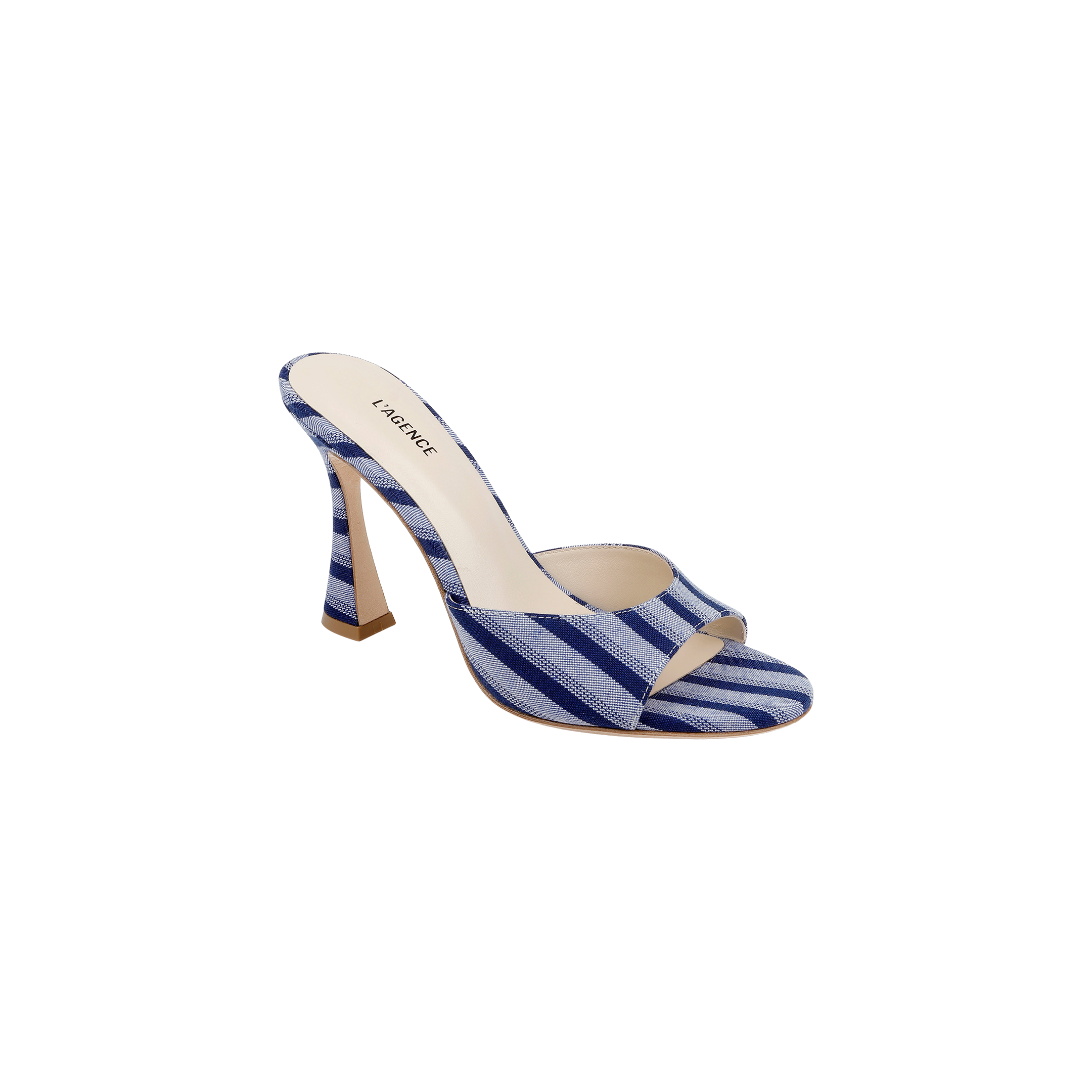 The Avery Open-Toe Mule is a blue striped denim high-heeled shoe featuring an open-toe design and a beige insole, displayed against a plain white background.