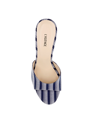 The Avery Open-Toe Mule is a women's flared heel shoe in blue striped denim with an open-toe design and LAGENCE branding on the insole.