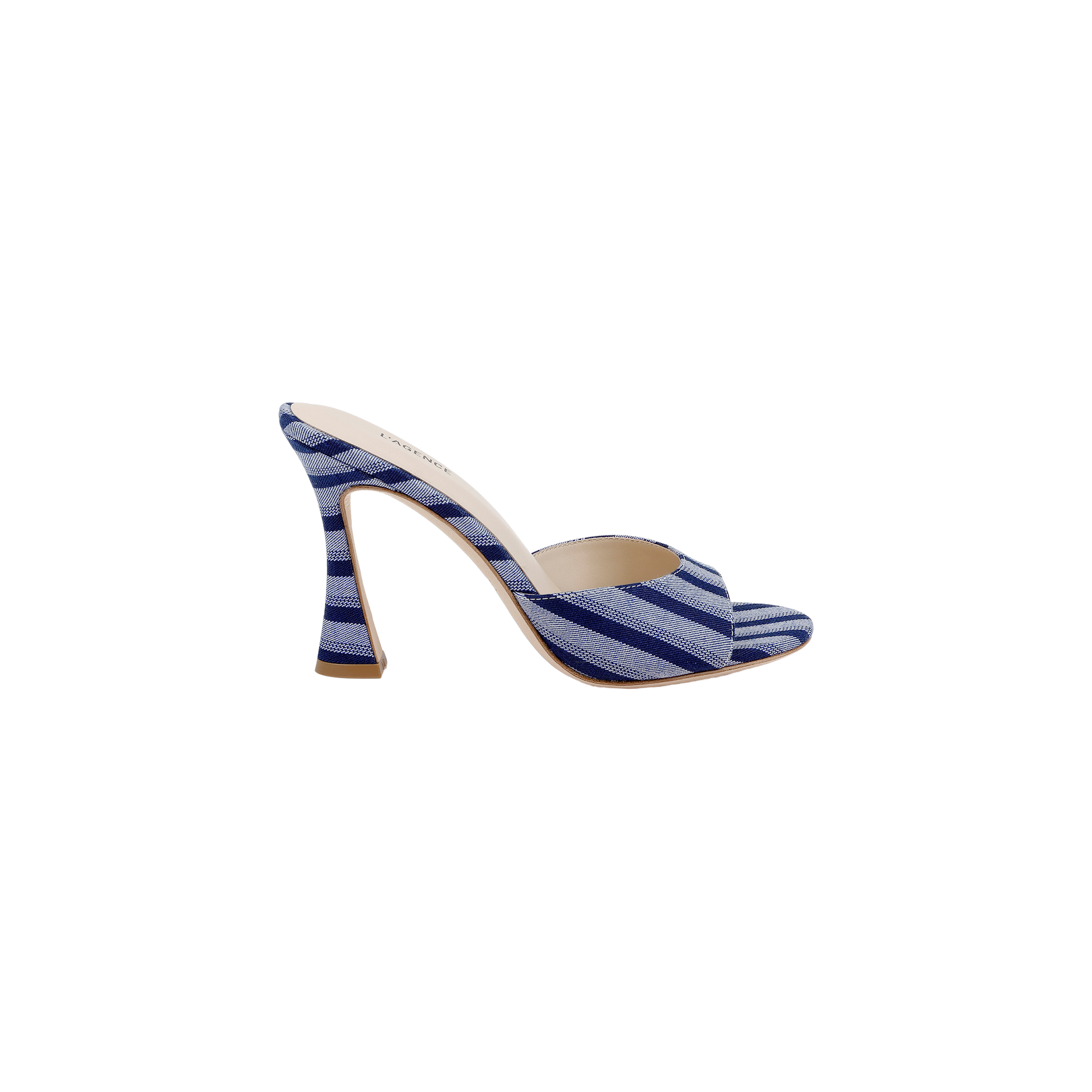 The Avery Open-Toe Mule features blue and white stripes on denim, an open toe, and a gracefully curved stiletto heel. This chic high-heeled sandal is presented against a plain white background.