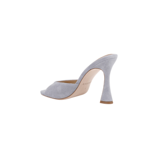 The Avery Suede Open-Toe Mule, a light gray high-heeled mule with a sculpted heel, open toe, and tan sole, is displayed against a plain white background. This stylish shoe features a plush memory foam insole for added comfort.