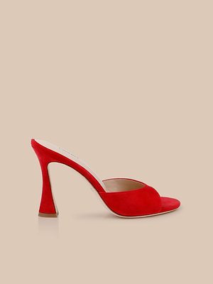 The Avery Suede Open-Toe Mule is a single red suede high-heeled sandal with a sculpted heel and memory foam insole, shown against a plain beige background.