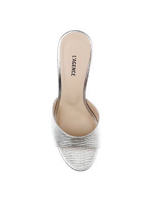 A top view of the Avery Leather Open-Toe Mule in silver lizard-embossed leather, featuring a sculpted high heel and a beige insole stamped with L’AGENCE.