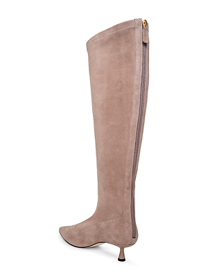 The Emilie Kitten-Heel Boot is a taupe stretch suede knee-high with a pointed toe, low kitten heel, and a full-length back zipper.