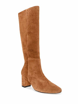 The Eugenie Block-Heel Boot in tan suede features a knee-high silhouette, pointed toe, and chic block heel, displayed against a white background.