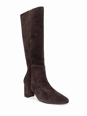 The Eugenie Block-Heel Boot is a tall, dark brown suede fall-to-winter boot with a block heel, pointed toe, and sleek minimalist design, shown on a white background.