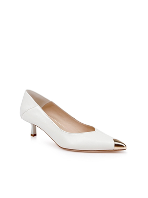 The Garlan Kitten-Heel Pump is a white leather shoe with a metallic gold pointed cap toe, featuring a low heel and a sleek, elegant design.