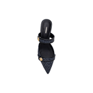 The Gilliane Heeled Mule, a single navy blue pointed-toe denim mule with two straps adorned with round gold lion-embossed buttons, is shown from above on a plain white background.