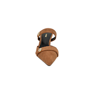The Gilliane Heeled Mule, crafted in brown suede with a pointed toe and vintage-inspired mule silhouette, features a gold lion-embossed button detail and a black insole, shown from above against a white background.