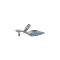 The Gilliane Denim Mule is showcased on a plain white background, featuring light blue denim material, a pointed toe, low kitten heel, two straps adorned with silver button details, a memory foam insole for added comfort, and a tan sole.