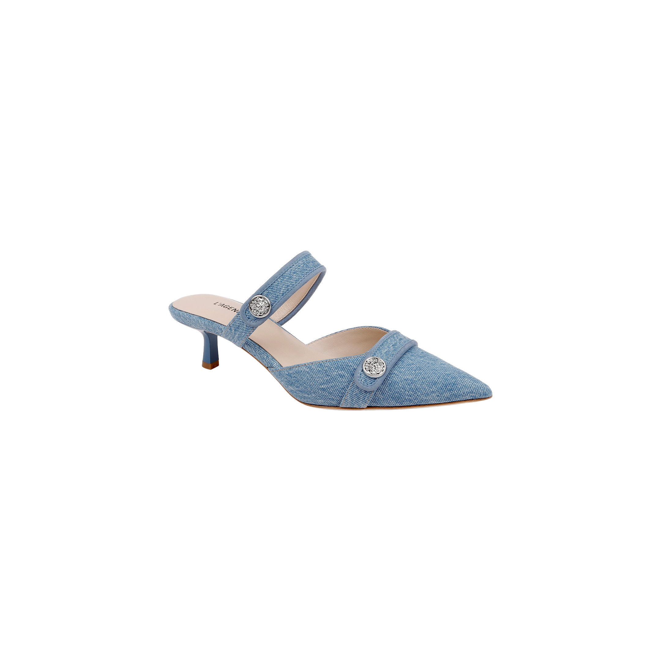Introducing the Gilliane Denim Mule—a chic light blue denim shoe featuring a pointed toe, low kitten heel, and two silver decorative buttons on the strap and upper. Designed for comfort with a memory foam insole, this stylish mule is showcased against a plain white background.