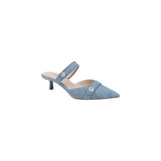 The Gilliane Denim Mule, featuring a pointed toe, low kitten heel, memory foam insole, and two decorative silver buttons on the straps, is displayed on a white background.