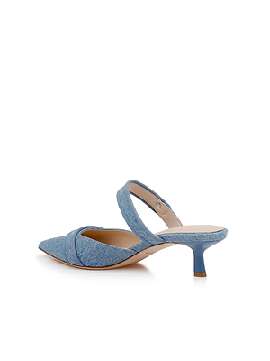 The Gilliane Denim Mule is a light blue pointed-toe mule with a low stiletto heel, thick top strap, and memory foam insole, shown on a white background.