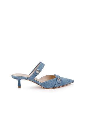 The Gilliane Denim Mule is a blue denim pointed-toe mule with two straps, silver button details, a low kitten heel, and a cozy memory foam insole—offering modern style and all-day comfort.