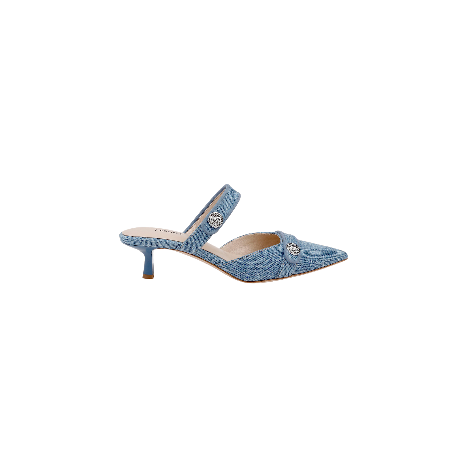 The Gilliane Denim Mule features a light blue denim design with a pointed toe, two straps adorned with decorative silver buttons, and a low kitten heel. Crafted for contemporary style, this modern mule also offers enhanced comfort with a memory foam insole. Pictured against a plain white background.