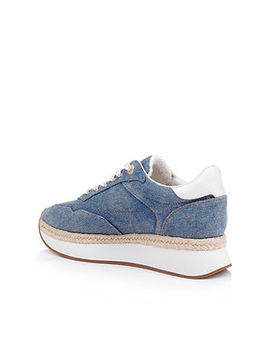 The Ivone Platform Sneaker features blue denim, white laces, a thick white platform sole, brown trim, and a white heel detail. Displayed on a white background.