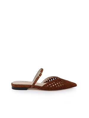 The Jacklyn Suede Flat Mule is a brown, pointed-toe sandal featuring a woven suede upper, perforated design, open back, and a thin ankle strap with buckle, shown on a white background.