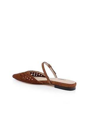 The Jacklyn Suede Flat Mule is a brown pointed-toe sandal with a woven suede upper, open side, slim ankle strap with buckle, and low black heel, shown on a white background.