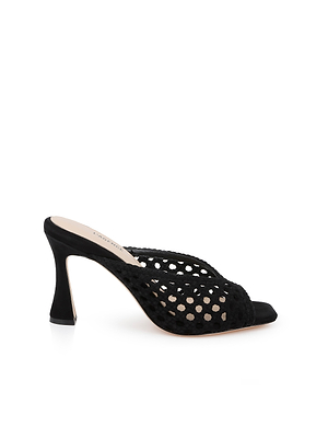 The Jacques Suede Mule features a black woven suede upper, open toe, and sculptural flared heel, shown against a white background.