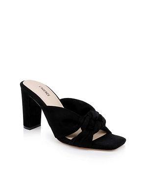 The Leonie Suede Block-Heel Sandal by L'AGENCE Sale is a black suede slip-on with a chunky heel, open toe, and knotted crisscross straps. The light beige insole is printed with LARINCE.