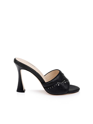 The Lille Leather Open-Toe Mule is a black high-heeled sandal featuring an open toe, Western heel, and upper strap adorned with small silver studs, shown against a white background.