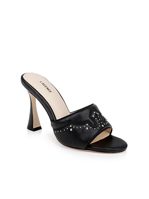 The Lille Leather Open-Toe Mule features black leather, silver studs, a wide front strap with Western-inspired heel, beige insole labeled LAGENCE, and a flared high heel.