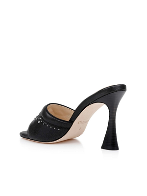 The Lille Leather Open-Toe Mule is a black leather mule with a Western heel, open toe, and curved silhouette, detailed with small silver studs on the upper and shown against a white background.