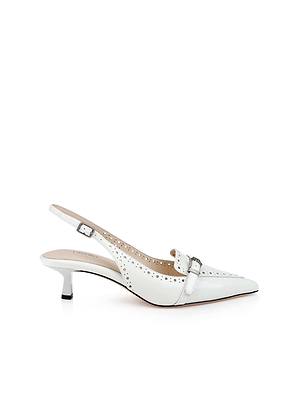 The Lourdes Leather Slingback Pump by L'AGENCE features white leather, a pointed toe, decorative perforations, a small front buckle detail, and an adjustable ankle strap. Shown against a plain white background.