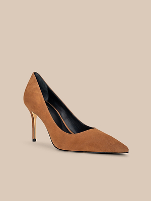 The Maelle Suede Pump is a classic pointed-toe stiletto in brown suede, showcased against a simple beige background.