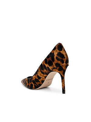 The Maelle Pump, a classic point-toe style covered in brown and black leopard hair calf, is displayed from the back and side on a white background.