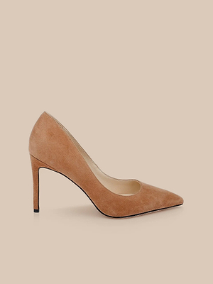 The Maelle Suede Pump is a classic light brown stiletto with a pointed toe, elegantly displayed on a neutral beige background.