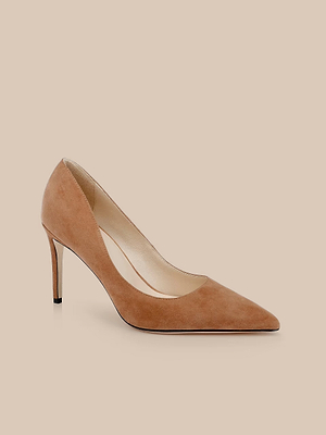 The Maelle Suede Pump features a pointed toe and stiletto heel in light brown suede, shown against a light beige background.